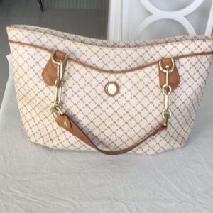 A Rioni Elegant Cream  and Tan Monogram print and leather trim.
